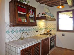 A kitchen or kitchenette at Villa Le Fonti di Santa Lucia by Interhome