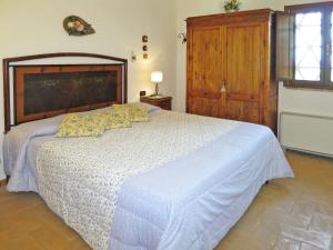 A bed or beds in a room at Villa Le Fonti di Santa Lucia by Interhome