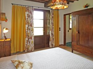 A bed or beds in a room at Villa Le Fonti di Santa Lucia by Interhome