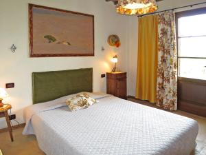 A bed or beds in a room at Villa Le Fonti di Santa Lucia by Interhome