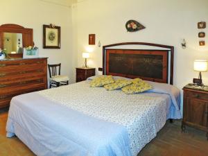 A bed or beds in a room at Villa Le Fonti di Santa Lucia by Interhome
