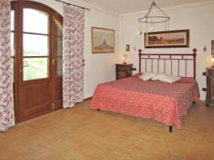 A bed or beds in a room at Villa Le Fonti di Santa Lucia by Interhome