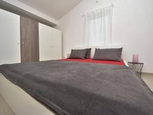 Postel nebo postele na pokoji v ubytování Holiday Home Villa Dalmacija by Interhome