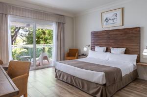Krevet ili kreveti u jedinici u okviru objekta Hotel Jerez & Spa