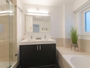 a bathroom with a sink and a mirror at Apartment Miramar by Interhome in Ostend