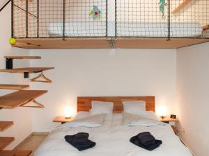 a bedroom with a bed with two towels on it at Apartment Cavriana by Interhome in Magadino