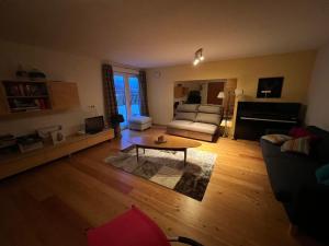 a living room with a couch and a coffee table at Haus Sonnenweg in Mariapfarr