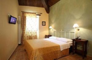 Voodi või voodid majutusasutuse Residence Borgo Da Mare toas