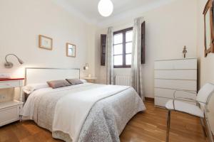Postel nebo postele na pokoji v ubytování La Casa Azul Almería