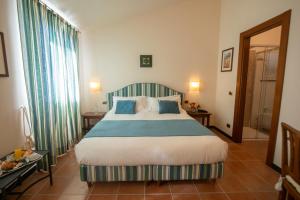 Postel nebo postele na pokoji v ubytování Hotel Al Terra Di Mare