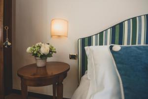 Postel nebo postele na pokoji v ubytování Hotel Al Terra Di Mare