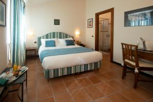 Postel nebo postele na pokoji v ubytování Hotel Al Terra Di Mare