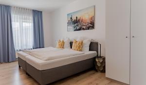 A bed or beds in a room at Argenta Living 16