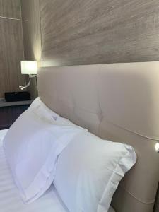 Postel nebo postele na pokoji v ubytování Hotel Tre Ville