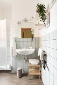 a bathroom with a sink and a mirror at Vatican Secret Rooms in Rome