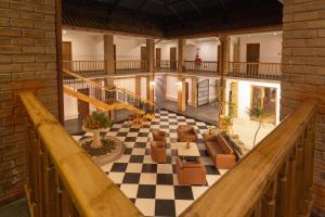 an old building with a lobby with a checkered floor at Hotel Campanario Del Mar in La Serena