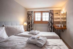 Giường trong phòng chung tại Hotel Ustria Parlatsch