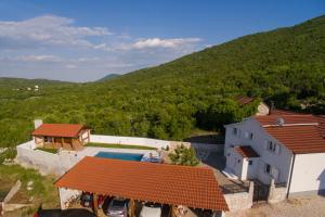 an aerial view of a house with a swimming pool at Vila M&M in Slivno