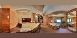 a room with two beds in a train room at Agriturismo Santa Serena in Cerreto di Spoleto