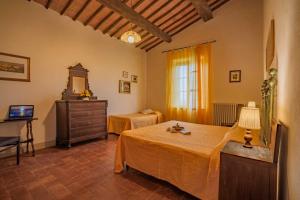 Postel nebo postele na pokoji v ubytování Agriturismo La Ripolina