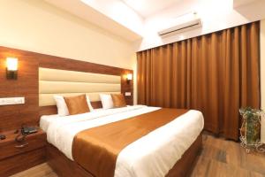 Hotel BlueArk tesisinde bir odada yatak veya yataklar
