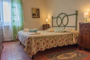 Postel nebo postele na pokoji v ubytování Agriturismo La Ripolina