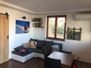 a living room with a couch and a table at Apartment Bella Vista 1 in Izola