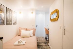 Postel nebo postele na pokoji v ubytování T2 à Paris Centre Smart TV, Nespresso, WIFI + 7 fotografií