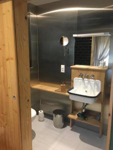 a bathroom with a sink and a toilet at Domaine de Malpas in Villers-le-Lac +34 photos
