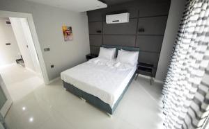 Кровать или кровати в номере Yaraşır Family Suite