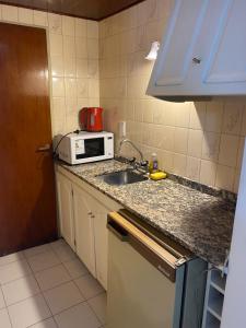 Kuchyň nebo kuchyňský kout v ubytování Portillo Apartments