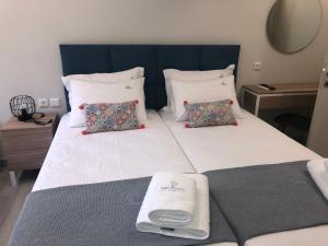 Krevet ili kreveti u jedinici u objektu PORTO PORTES suites