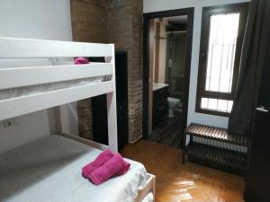 Posteľ alebo postele v izbe v ubytovaní Casa Sevilla Nervión-Centro