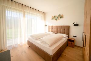 Ένα ή περισσότερα κρεβάτια σε δωμάτιο στο Garden Lodge
