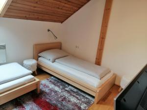 A bed or beds in a room at Appartement Moni / Golf & Ski - TOP 9