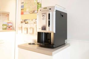 a coffee machine sitting on a counter in a museum at Bamberg Inn in Hallstadt