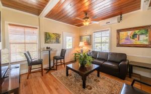 a living room with a couch and a table and chairs at Old Colorado Inn in Stuart