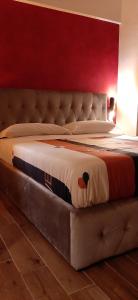 A bed or beds in a room at Appartamento ALECATIA 2