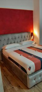 A bed or beds in a room at Appartamento ALECATIA 2