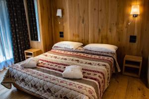 Postel nebo postele na pokoji v ubytování Hotel Dufour