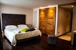 Postel nebo postele na pokoji v ubytování Hotel Dufour