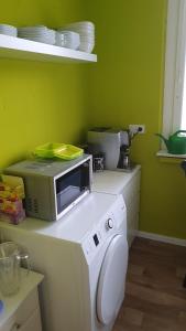 a kitchen with a microwave sitting on a counter at Berlin mednow 1 in Berlin