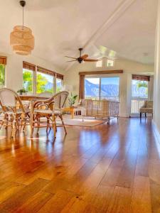 a large living room with a table and chairs at Villas of Kamali'i Mountain Waterfall Views in Princeville