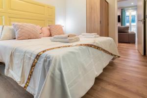 A bed or beds in a room at MintyStay - Campoamor