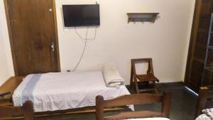 Hostel da Moda tesisinde bir televizyon ve/veya eğlence merkezi