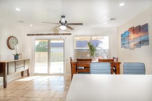 a dining room with a ceiling fan and a table and chairs at Cozy Home - Self Check-In w/Spacious Deck in San Antonio