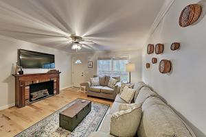 a living room with a couch and a fireplace at Brownstone Escape in Asheville