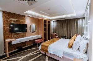 Телевизор и/или развлекательный центр в Lambert Hotel