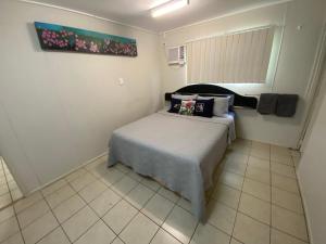 A bed or beds in a room at Tolga Caravan Park