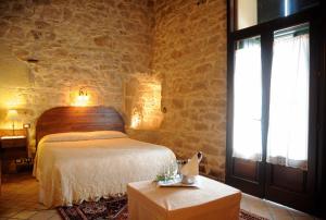Letto o letti in una camera di Torre Don Virgilio Country Hotel